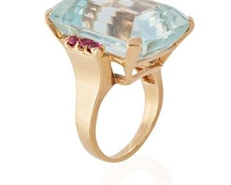 129
A Retro Aquamarine And Ruby Ring
14k yellow gold; Stamped: 14k
Centering a rectangular step-cut aquamarine gauged at 25.2mm x 17.2mm x 12.0mm weighing approximately 37cts. and flanked on either side by a total of six round mixed-cut rubies totaling approximately 0.50ct. in weight
Ring size 8.5
16.8 grams
Estimate: $800 - $1,200