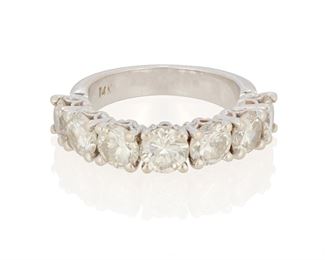 134
A Diamond Band
14k white gold: Stamped; 14k
Centering seven round full-cut diamonds totaling approximately 3.00cts. in weight and each graded I-J color and VS/SI clarity
Ring size: 5.25
5.3 grams
Estimate: $1,500 - $2,000
