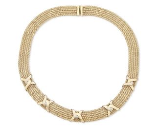 135
A Gold Collar Necklace
14k yellow and white gold; Stamped: 14k
A collar style necklace featuring a two-tone "X" motif
0.50" W x 16.5" L
48.0 grams
Estimate: $1,200 - $1,800