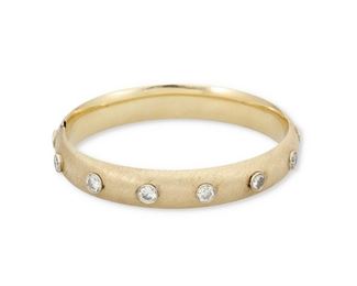 138
A Diamond Hinged Bangle Bracelet
14k yellow gold; Stamped: 14k
Set with thirteen bezel set round full-cut diamonds totaling approximately 4.00cts. in weight and graded H-I color and I clarity
0.375" W x 6.5" Cir
15.0 grams
Estimate: $2,000 - $3,000
