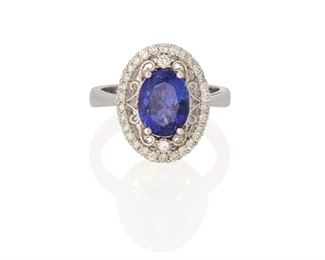 139
A Tanzanite And Diamond Ring
14k white gold; Stamped: K14
Centering an oval mixed-cut tanzanite gauged at 9.5mm x 7.2mm x 5.7mm weighing approximately 3.10cts. and surrounded by thirty-two round full-cut diamonds totaling approximately 0.45ct. in weight and each graded H-J color and SI2/I1 clarity (0.50" W x 0.625" H)
Ring size: 6.75
5.0 grams
Estimate: $1,000 - $1,500