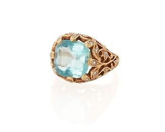 141
A Blue Glass And Diamond Ring
18k yellow gold
Centering a rectangular-cut blue glass stone, within an openwork filigree mounting set with small round rose-cut diamonds
Ring size: 6
8 grams
Estimate: $800 - $1,200