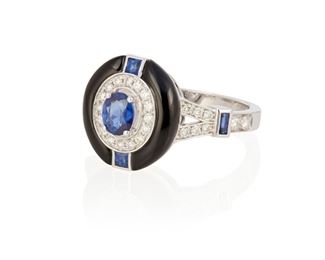 145
A Sapphire, Diamond And Onyx Ring
18k white gold; Stamped: 750 / D0.30ct / S0.69ct
Centering an oval mixed-cut sapphire gauged at 5.0mm x 4.1mm x 2.3mm flanked on all sides by two square and two rectangular step-cut sapphires all with a total exact weight of 0.69ct. and accented with thirty round full-cut diamonds totaling exactly 0.30ct. finished with an oval shaped halo of carved onyx (0.50" Dia)
Ring size: 7.25
5.0 grams
Estimate: $700 - $900