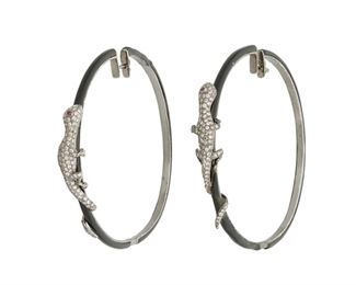 148
A Pair Of Diamond And Enamel Lizard Hoop Earrings
18k oxidized gold; Stamped: 750
Featuring a lizard design set with approximately two hundred twenty-five round full-cut diamonds totaling approximately 2.00cts. in weight and graded gray and brown in color and SI/I clarity and further set with two round mixed-cut rubies on black enamel hoop earrings
2.625" W x 2.25" H
19.8 grams
2 pieces
Estimate: $800 - $1,200