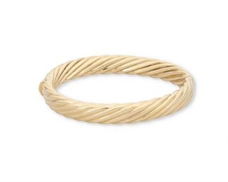 153
A Gold Hinged Bangle
14k yellow gold; Stamped: 14k / Italy
of a fluted gold design
7.0" Cir x 0.375" W
25.9 grams
Estimate: $600 - $800