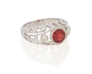 157
A Spessartite Garnet And Diamond Ring
18k white gold; Stamped: 18k / 750 / 74
The bombe style ring centers a bezel set round mixed-cut spessartite garnet gauged at 6.6mm x 6.6mm x 4.1mm weighing approximately 1.25cts. surrounded by twenty round full-cut diamonds totaling approximately 0.60ct. and graded G-H color and SI clarity (ring size: 7.25)
0.375" H
6.7 grams
Estimate: $800 - $1,200