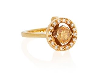 163
A Brown Diamond Ring
18k yellow gold; Stamped: 18k
Centering a round full-cut diamond gauged at approximately 1.05cts. and graded yellowish-brown in color and SI2 clarity and further surrounded by a halo of sixteen round full-cut diamonds totaling approximately 0.30ct. and graded H-I color and SI clarity (0.50" Dia)
Ring size: 5.25
8.1 grams
Estimate: $2,000 - $3,000