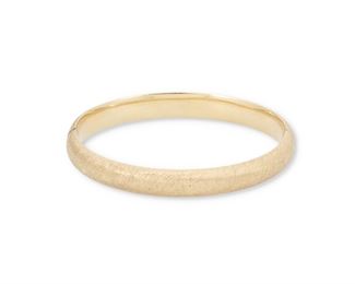 164
A Hinged Bangle Bracelet
14k yellow gold; Stamped: 14k / 26898
with a Florentine finish
0.3125" W x 6.75" Cir
9.9 grams
Estimate: $400 - $600