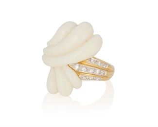 166
A White Onyx And Diamond Ring
18k yellow gold
Comprising a carved scalloped white onyx center offset with three rows of eleven round full-cut diamonds totaling approximately 0.20ct. in weight (ring size: 7)
1.0" H
8.7 grams
Estimate: $500 - $700