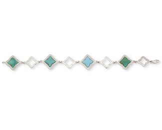 170
A Turquoise And Diamond Bracelet
14k white gold; Stamped: 14k / 585 / A
A double-sided link bracelet comprising of carved ribbed turquoise quatrefoils surrounded by a total of one hundred ninety-two round full-cut diamonds totaling approximately 1.50cts. and graded H-I color and SI clarity alternating with open quatrefoil links
0.75" W x 7.25" L
14.2 grams
Estimate: $800 - $1,200