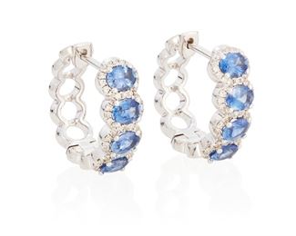 177
A Pair Of Sapphire And Diamond Hoop Earrings
18k white gold; Stamped: 18k / 750
Set with eight oval mixed-cut sapphires totaling 1.62cts. in weight and one hundred ten round full-cut diamonds totaling 0.25ct. in weight and graded H-I color and SI2/I1 clarity
0.50" Dia
5.4 grams
2 pieces
Estimate: $1,500 - $2,000