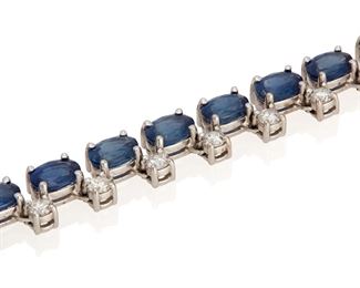 178
A Sapphire And Diamond Bracelet
14k white gold
Set with sixteen oval mixed-cut sapphires gauged at 6mm x 4mm totaling approximately 8.00cts. and further set with seventeen round full-cut diamonds totaling approximately 1.00ct. in weight and graded H-I color and SI/I clarity
0.25" W x 6.5" L
14.2 grams
Estimate: $1,000 - $1,500