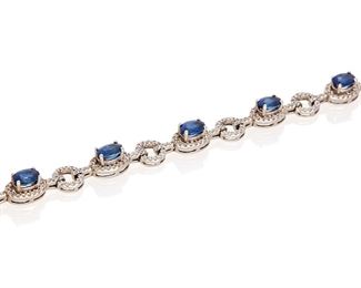 181
A Sapphire And Diamond Bracelet
14k white gold; Stamped: 14k
Set with eight oval mixed-cut sapphires each gauged at 6.1mm x 4.2mm x 3mm totaling approximately 4.90cts. in combined weight and further accented with three hundred two round full-cut diamonds totaling approximately 2.50cts. in weight and graded H-I color and I clarity
0.25" W x 7.0" L
12.1 grams
Estimate: $1,000 - $1,500