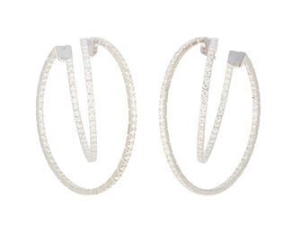 186
A Pair Of Diamond Double Hoop Earrings
18k white gold; Stamped: 750
Set with two hundred twenty round full-cut diamonds totaling approximately 4.40cts. in weight and graded H-I color and SI clarity
1.0" W x 1.75" H
15.3 grams
2 pieces
Estimate: $5,000 - $7,000