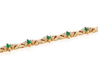 194
An Emerald And Diamond Bracelet
14k yellow gold; Stamped: 14k
Set with eleven marquise-cut emeralds each gauged at approximately 5.0mm x 2.8mm further accented by sixty-six round full-cut diamonds totaling approximately 2.00cts. in weight and each graded I-J color and SI2/I1 clarity
0.25" W x 7.25" L
15.9 grams
Estimate: $1,000 - $1,500