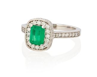 195
An Emerald And Diamond Ring
14k white gold; Stamped: 14k
Centering a rectangular step-cut emerald gauged at 6.7mm x 4.8mm x 2.7mm weighing approximately 0.60ct. and surrounded by fifty-six round full-cut diamonds totaling approximately 0.60ct. and graded H-J color and SI2/I1 clarity (0.375" W x 0.4375" H)
Ring size: 6.25
4.3 grams
Estimate: $500 - $700
