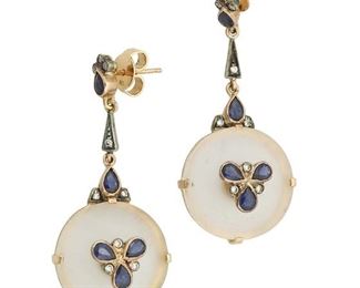 196
A Pair Of Rock Crystal, Sapphire And Diamond Earrings
Silver topped 18k yellow gold and 18k yellow gold
Comprising of circular frosted rock crystal drops each gauged at 19.8mm in diameter set with a total of ten pear shaped sapphires each gauged at 4.2mm x 3.2mm x 1.9mm totaling approximately 1.80cts. and further accented by eighteen round full-cut diamonds totaling approximately 0.40ct. and graded light brown in color and VS clarity
0.875" W x 1.875" H
14.2 grams
2 pieces
Estimate: $600 - $800