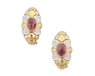 200
A Pair Of Pink Tourmaline And Diamond Earrings
18k yellow and white gold; Stamped: 750 / unclear hallmark
The huggie style earrings each feature one oval cabochon (faceted pavilion) pink tourmaline each gauged at 8mm x 6mm accented with a floral design of twenty-four round full-cut diamonds totaling approximately 0.30ct. and each graded G-H color and VS clarity finished with post and omega clips on the reverse
0.50" W x 0.875" H
10.5 grams
2 pieces
Estimate: $600 - $800