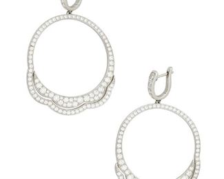 205
A Pair Of Diamond Hoop Earrings
18k white gold; Stamped: 750 / HOF
Set with approximately one hundred ninety-five round full-cut diamonds totaling approximately 5.00cts. in combined weight and graded G-H color and VS clarity
1.375" W x 2.25" H
13.5 grams
2 pieces
Estimate: $1,500 - $2,000