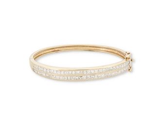 209
A Diamond Hinged Bangle Bracelet
14k yellow gold
Set with sixty princess-cut diamonds totaling approximately 4.50cts. of weight and graded H-I color and SI/I1 clarity
0.25" W x 6.0" Cir
17.0 grams
Estimate: $800 - $1,200