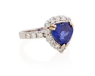 210
A Tanzanite And Diamond Ring
18k white and yellow gold; Stamped: 18k
Centering a heart-shaped tanzanite gauged at 8.6mm x 9.9mm x 6.3mm weighing approximately 4.00cts. and surrounded by twenty round full-cut diamonds totaling approximately 1.15cts. in weight and graded H-J color and VS/SI1 clarity (0.50" Dia)
Ring size: 6.5
8.9 grams
Estimate: $1,000 - $1,500