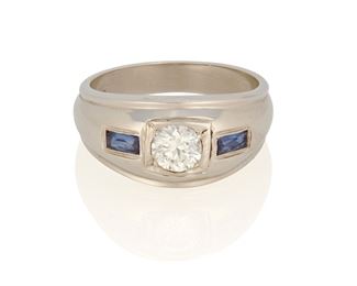 216
A Diamond And Sapphire Ring
18k white gold; Stamped: MN18k
The ring centers one old European-cut diamond gauged at 5.2mm x 5.3mm x 3.3mm weighing approximately 0.55ct. and graded H-I color and VS clarity flanked on either side by two fancy baguette-cut sapphires each gauged at approximately 4mm x 2mm
Ring size: 9.5
9.1 grams
Estimate: $1,000 - $1,500