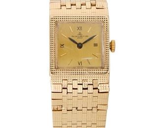 219
A Baume & Mercier Gold Wristwatch
14k yellow gold
A square gilt dial with applied polished gilt baton hour markers, signed Baume & Mercier Geneve with a jeweled quartz movement within a 14k yellow gold case with an integrated bracelet, textured surface, hallmarked, Ref: 4854
22mm x 178mm
49 grams
Estimate: $1,500 - $2,000