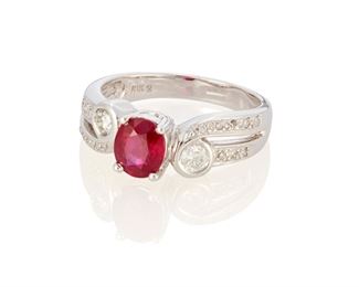 222
A Ruby And Diamond Ring
18k white gold; Stamped: 18k / 750
Centering an oval mixed-cut ruby gauged at 6.6mm x 5.7mm x 3.5mm weighing approximately 1.05cts. flanked by two bezel set round full-cut diamonds totaling approximately 0.30ct. in weight and graded G-H color and VS clarity and an additional sixteen round full-cut diamonds lining the shoulders totaling approximately 0.10ct.
Ring size: 7
5.6 grams
Estimate: $800 - $1,200