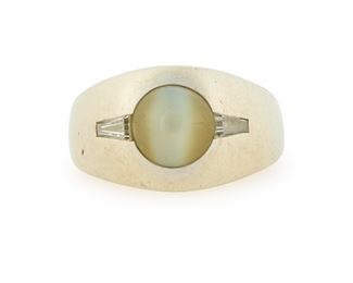 226
A Cat's Eye Chrysoberyl Ring
18k white gold; Stamped: 18k / ACC
Centering a bezel set round cat's eye chrysoberyl gauged at 8.0mm x 8.0mm x 5mm flanked on either side by two tapered baguette-cut diamonds totaling approximately 0.35ct. and graded H-I color and SI clarity (ring size: 9.5)
0.50" H
14.2 grams
Estimate: $600 - $800