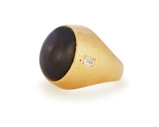 229
A Star Sapphire Ring
14k yellow gold; Stamped: 14k / Ultra
Centering a bezel set star sapphire gauged at 17.8mm x 14mm x 9.3mm flanked on either side by two baguette-cut diamonds totaling approximately 0.40ct. in combined weight and graded F-G color and VS clarity (ring size: 8)
0.875" H
22.9 grams
Estimate: $800 - $1,200