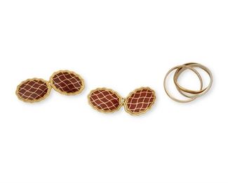 230
A Cartier Ring And A Pair Of Longmire Cufflinks
18k gold: Ring stamped: Cartier / 750 / 57 CH 811 / French hallmarks; Cufflinks stamped: 750 / Longmire / English assay marks
Including an 18k tri-colored gold Cartier "Trinity" ring (each band 2.6mm wide; ring size: 7.5) and a pair of Longmire 18k yellow gold and red enamel cufflinks (0.50" W x 0.75" H)
Ring: 5.8 grams; Cufflinks: 22.4 grams
3 pieces
Estimate: $800 - $1,200
