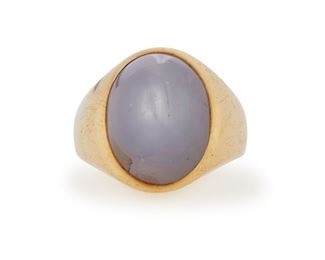 234
A Star Sapphire Ring
14k yellow gold; Stamped: 14k yellow gold
Centering a bezel set oval star sapphire gauged at 16.7mm x 13mm x 9.6mm
Ring size: 9.5
17.8 grams
Estimate: $1,200 - $1,800