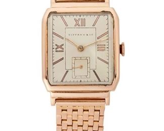 241
A Tiffany & Co. Gold Wristwatch
14k rose gold
With a two-tone silvered dial, Roman numeral and button hour markers, outer minute track, sub-seconds dial, signed Tiffany & Co. with a 17 jewel stem wind and set movement, signed Movado Factories within a 14k rose gold case and bracelet, signed Movado Factories Switzerland, #44743 / 476149
36mm x 25mm. 6.5" L
47 grams
Estimate: $1,200 - $1,800