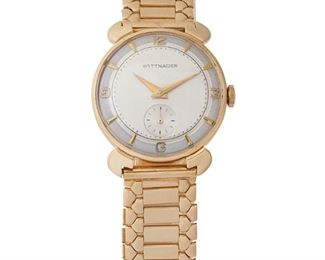 242
A Wittnauer Gold Wristwatch
14k yellow gold
A round two-tone silvered dial, applied gilt hour markers, sub seconds dial, dauphine gilt hands, signed Wittnauer with a 17 jewel manual stem wind and set movement, Cal: 76 Revue, signed Wittnauer Inc. Watch Co. within a 14k yellow gold smooth polish case with stylized flared lugs, signed Longines-Wittnauer Watch Co. Inc., #96617, hallmarked with a matching 14k yellow gold link bracelet, hallmarked
34mm x 29mm
43 grams
Estimate: $1,200 - $1,800