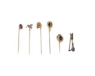 248
A Group Of Five Stick Pins And One Golf Pin
Including a 14k rose gold, oval mixed-cut pink tourmaline and rose-cut diamond pin (0.25" W x 0.375" H), a 14k yellow gold and lapis lazuli pin (0.50" W x 0.625" H), a 14k yellow gold, turquoise and seed pearl insect pin (0.375" Dia), an 18k yellow gold (with 14k yellow gold stick), diamond and enamel circle pin (0.375" Dia), a 14k yellow gold, pear shaped cat's eye chrysoberyl gauged at 8mm x 5.65mm x 4.85mm pin accented with one round full-cut diamond gauged at 0.06ct. and a silver golf club pin accented with calibre-cut and round sapphires, antique single-cut diamonds and centering a seed pearl (1.25" L x 0.25" H)
14k: 5.8 grams; 18k: 1.4 grams; Silver: 2.3 grams
6 pieces
Estimate: $400 - $600
