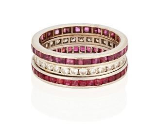 254
A Ruby And Diamond Eternity Band
14k white gold
Centering thirty-one round full-cut diamonds totaling approximately 0.75ct. in weight and graded H-I color and SI clarity flanked with seventy-six calibre-cut rubies totaling approximately 3.80cts. in weight (0.3125" H)
Ring size: 7
6.8 grams
Estimate: $500 - $700