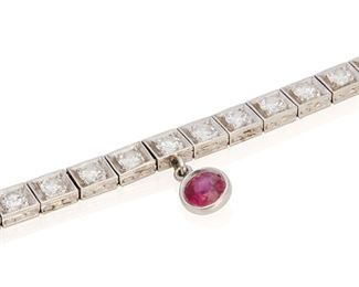255
A Diamond And Ruby Bracelet
Platinum; Stamped: 25925
Set with thirty-eight old European-cut diamonds totaling approximately 3.50cts. in weight and graded G-H color and VS clarity further set with a bezel set round mixed-cut ruby charm gauged at 4.8mm in diameter and weighing approximately 0.50ct.
0.125" W x 7.0" L
16.6 grams
Estimate: $1,000 - $1,500