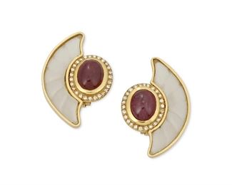 256
A Pair Of Ruby, Rock Crystal And Diamond Ear Clips
18k yellow gold; Stamped: Italy / 750 / Assay marks
The stylized crescent shaped ear clips feature two oval cabochon rubies each gauged at 10.7mm x 8mm x 5.3mm and 10.7mm x 8.1mm x 4.6mm accented by a halo of fifty-four round full-cut diamonds totaling approximately 0.50ct. in weight and each graded H-I color and SI clarity and offset with a bezel set carved frosted rock crystal fan design
0.875" W x 1.25" H
16.2 grams
2 pieces
Estimate: $700 - $900