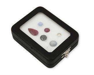 274
Six Unmounted Gemstones
Including an 0.84ct. round full-cut diamond graded brown in color and VS clarity, a 4.57cts. round full-cut black diamond, a 10.04cts. pear mixed-cut ruby, a 3.71cts. cushion-cut ruby, a 2.57cts. square step-cut sapphire and a 7.17cts. oval star-sapphire
Estimate: $800 - $1,200