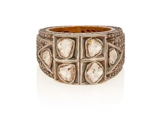 275
An Indian Diamond Ring
Silver and 14k yellow gold
Featuring six tablet-cut diamonds the largest gauged at 5.2mm in diameter and graded light brown in color and I2 clarity further set with two hundred seventy-eight round single-cut diamonds totaling approximately 1.25cts. in weight and graded gray and brown in color and SI2-I2 in clarity (0.5625" W)
Ring size: 7.5
14.9 grams
Estimate: $500 - $700