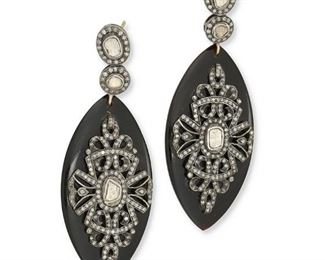 277
A Pair Of Indian Diamond And Onyx Ear Pendants
Silver and 14k yellow gold
The marquise onyx discs earrings are set with six tablet-cut diamonds largest gauged at 5mm x 4mm graded yellow in color and I2 clarity further surrounded by four hundred round single-cut diamonds totaling approximately 2.00cts. in weight and each graded gray/brown in color and I2/I3 clarity
1.0" W x 2.75" H
22.5 grams
2 pieces
Estimate: $800 - $1,200