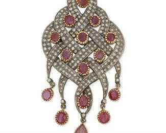 279
An Indian Ruby And Diamond Pendant/Brooch
Silver and 14k yellow gold
Set with fourteen oval mixed-cut rubies, the largest gauged at 6.1mm x 5.0mm and one pear mixed-cut ruby gauged at 9.9mm x 6mm further set with approximately two hundred forty-six round full and single-cut diamonds totaling approximately 3.50cts. in combined weight each graded light brown in color and SI/I clarity
1.5" W x 3.0" H
15.4 grams
Estimate: $800 - $1,200