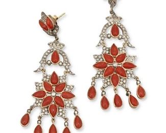 286
A Pair Of Indian Coral And Diamond Ear Pendants
14k yellow gold and silver
Featuring thirty-two pear shaped cabochon-cut coral gauged at 7mm x 4mm surrounded by one hundred forty-four round single-cut diamonds totaling approximately 1.20cts. in weight and graded brown in color and SI2/I2 clarity
1.0" W x 2.75" H
18.1 grams
2 pieces
Estimate: $1,200 - $1,800