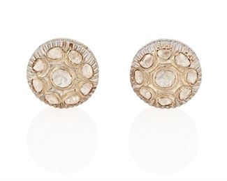 288
A Pair Of Indian Diamond Earrings
Silver and 14k yellow gold
Set with a cluster of eighteen tablet-cut diamonds largest gauged at 5.5mm in diameter graded K-M in color and I2 clarity with post and omega clip backings
0.75" W
18.1 grams
2 pieces
Estimate: $500 - $700