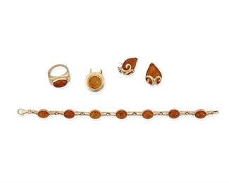 326
A Group Of Amber Jewelry
14k yellow gold gold: Variously stamped: 14k / Italy
A group of 14k yellow gold jewelry including a bracelet set with seven oval cabochon amber each gauged at approximately 9.5mm x 7.5mm ( 0.315" W x 7.5" L), a ring set with an oval cabochon amber gauged at 13.6mm x 9.8mm (ring size: 7.25), a pair of earrings centering two pear shaped cabochon amber each gauged at 20mm x 15mm with post and omega clip backings (0.625" W x 0.875" H) and a pendant centering a round cabochon amber gauged at 11.5mm in diameter ( 0.75" W x 0.875" H)
30.1 grams
5 pieces
Estimate: $800 - $1,200