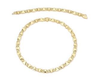 343
A Set Of Gold Jewelry
18k yellow gold; Each stamped: Kria
Including a fancy link necklace (0.25" W x 17.0" L) and a matching bracelet (0.25" W x 7.5")
96.2 grams
2 pieces
Estimate: $800 - $1,200