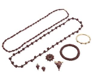 348
A Group Of Garnet Jewelry
18k yellow gold, 14k yellow gold, silver and metal; Variously stamped: 18k / 14k
A group of garnet jewelry including an 18k yellow gold and round garnet bead grape brooch (1.375" W x 1.625" H, 15.7 grams), two matching 14k yellow gold, silver and garnet grape pendants (0.625" W x 1.375" H, 8.6 grams for the pair), a 14k yellow gold and garnet hinged bangle bracelet (0.25" W x 6.25" Cir, 13.0 grams), a silver and purple glass circle brooch/pendant (1.50" Dia, 7.8 grams), a tumbled garnet bead bangle bracelet ( 0.375" W x 8.0" Cir, 35.8 grams) and two garnet bead necklaces one with a metal clasp (34.0" L and 33.0" L)
8 pieces
Estimate: $500 - $700