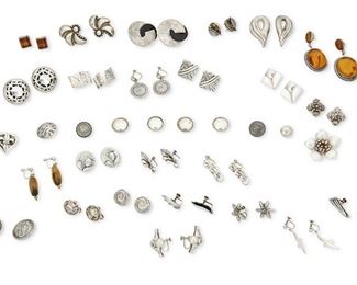 365
A Large Group Of Silver Jewelry
Mid-20th century and later
Most marked for silver; eight marked for Mexico; one marked for Denmark
Comprising twenty-seven pairs of silver earrings in various styles and designs including floral, figural, and geometric; some with stone beads, inset amber, shell inlay, and freshwater pearls, as well as two silver pendants and a mixed group of buttons, 64 pieces approximately
Largest (amber): 2.625" H x 1.125" W; smallest (pearl): 0.375" Dia.
205.9 grams
Estimate: $300 - $500