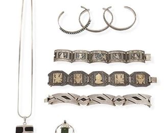 367
A Large Group Of Silver Jewelry
Including a sterling silver Mexican Pedro Romero bracelet, stamped: Romero / Taxco / 925 / Sterling (7.0" L x 0.75" W), a sterling silver Gavida bracelet with five gilt figural panels, stamped: Gavida / Peru / 925 (7.0" L x 1.25" W), a silver Guatemalan bracelet with five figural links, stamped: Made in Guate / 900 ( 6.25" L), a silver Mexican Quintin V and onyx pendant on chain, stamped: Quintin V / Mexico / Taxco / 966 (22" L x 2.5" H x 1.125" W), a silver jade kiwi pendant and three various open cuff bracelets
246.5 grams
8 pieces
Estimate: $400 - $600