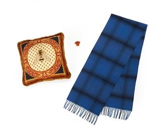 372
A Group Of Atelier Versace Items
Late 20th/Early 21st Century
Including an Atelier Versace silk twill fringed bee cushion with zip closure and removable inner cushion, printed with Atelier Versace logo to each side; Fabric and care label to inside: Made in Italy, Gianni Versace / Made in Italy, 16.5" H x 16.5" W., A blue and grey plaid cashmere and wool fringed scarf, 90% Cashmere / 10% Lana Wool / Made in Italy, 67.0" L x 12.75" W; 74.0" L with fringe, A small Medusa paperweight in sanded amber glass, Unmarked, 1.75" H x 2.125" W
3 pieces
Estimate: $400 - $600